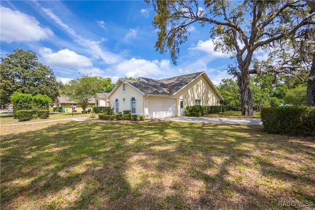 view of home's exterior with a lawn, concrete driveway, stucco siding, and a garage