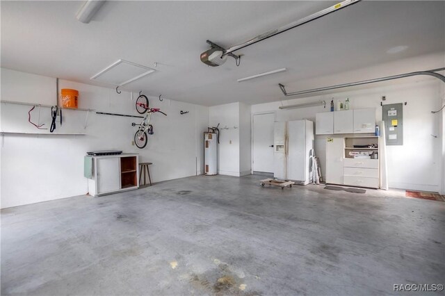 garage featuring white refrigerator with ice dispenser, electric panel, water heater, and a garage door opener