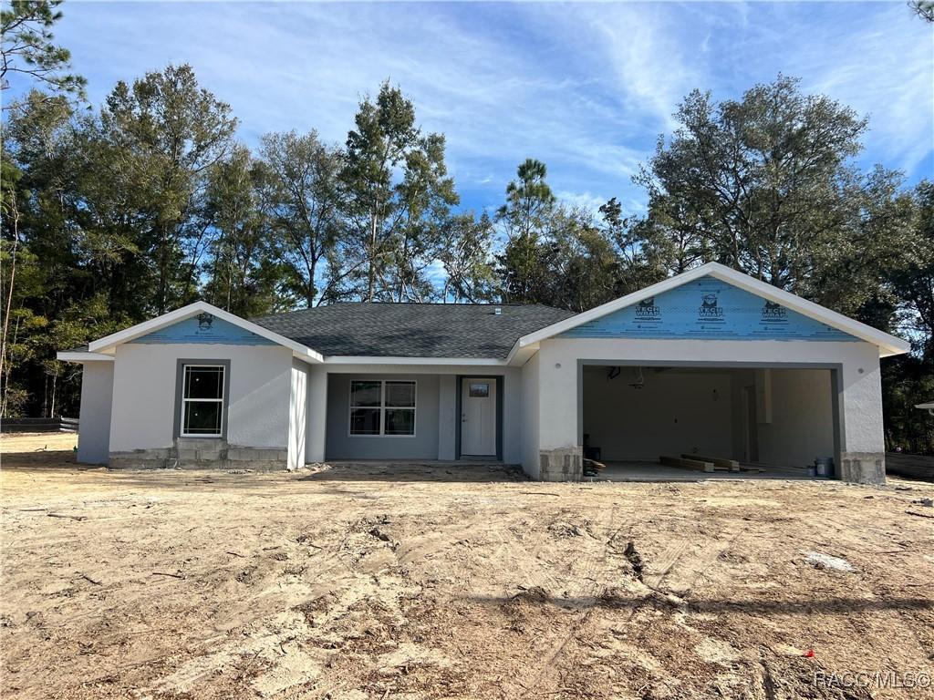 ranch-style house featuring a garage