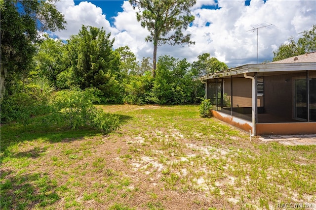 view of yard with a sunroom