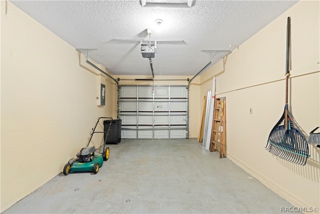 garage featuring electric panel and a garage door opener