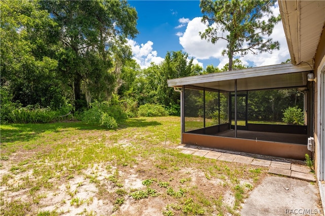 view of yard featuring a sunroom