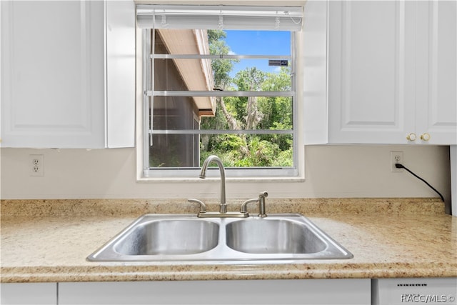 kitchen with white cabinets and sink