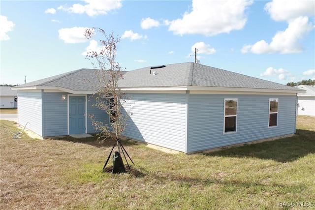 back of house with a yard