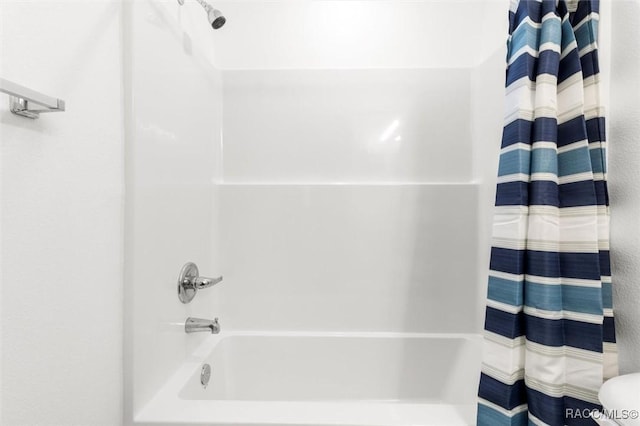 bathroom featuring shower / bath combo with shower curtain