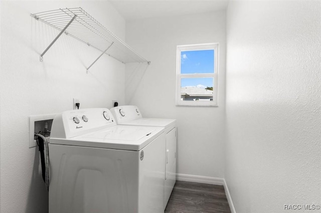 laundry room with washing machine and dryer and dark hardwood / wood-style flooring