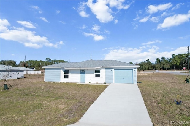 view of front of house with a front lawn and a garage