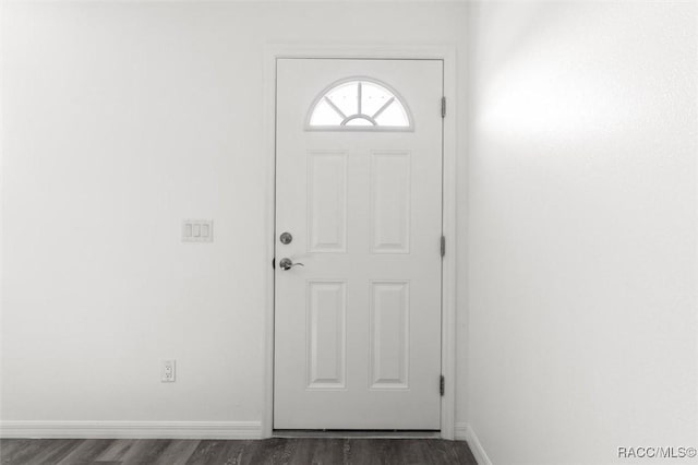 doorway to outside featuring dark hardwood / wood-style floors