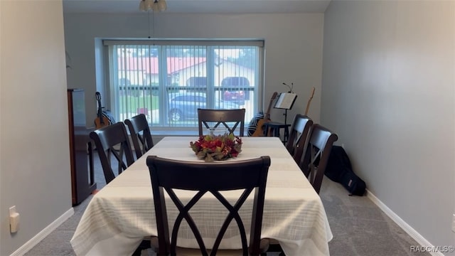 view of carpeted dining area