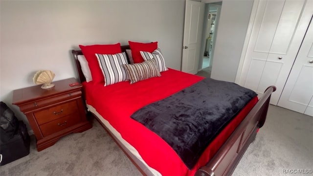 bedroom with light colored carpet