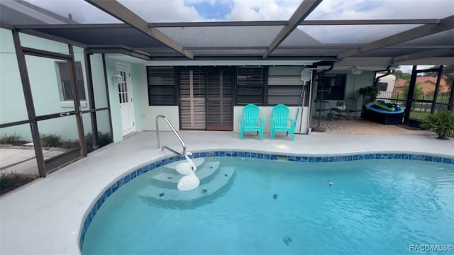 view of pool featuring a lanai and a patio area