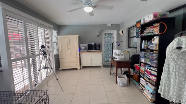 kitchen with light tile patterned floors and ceiling fan