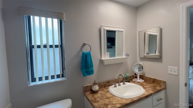 bathroom with vanity and toilet