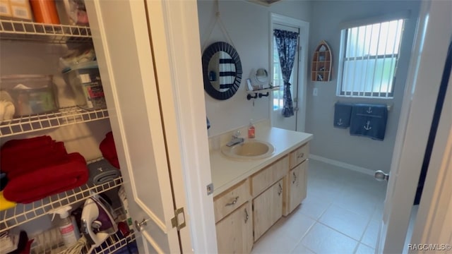 bathroom with tile patterned floors and vanity