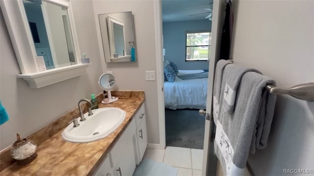 bathroom with tile patterned floors, ceiling fan, and vanity