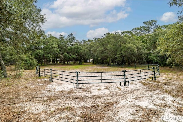 4200 W Breckenridge Ct, Beverly Hills, FL 34465 - view of street with a rural view, an outdoor riding arena, and a wooded view