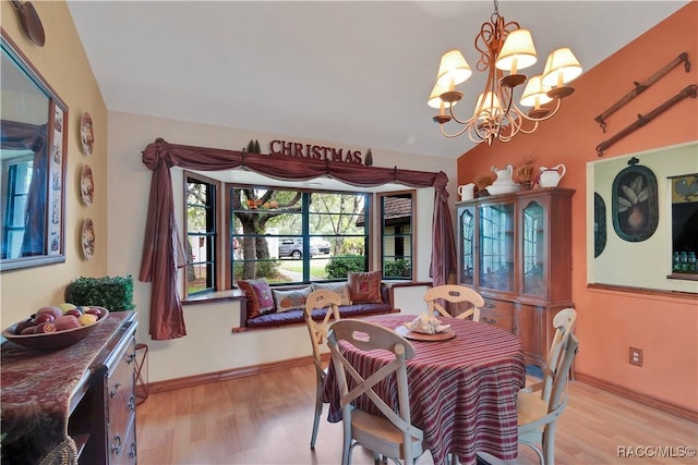 4200 W Breckenridge Ct, Beverly Hills, FL 34465 - dining area with light wood-style flooring and a chandelier