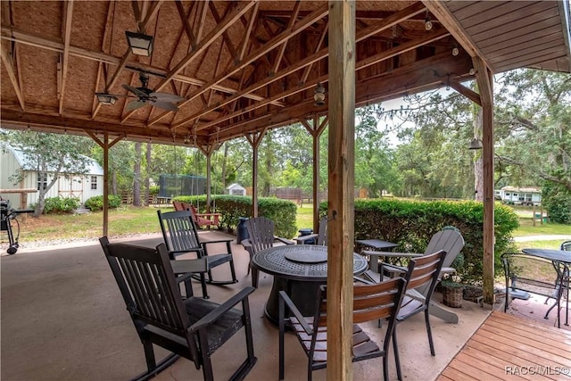 4200 W Breckenridge Ct, Beverly Hills, FL 34465 - view of patio / terrace with a trampoline, ceiling fan, an outdoor fire pit, and a storage unit