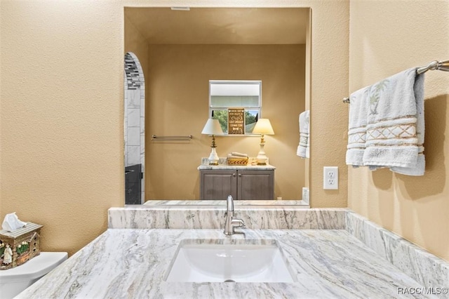 5061 W Oakhill St, Dunnellon, FL 34433 - bathroom with vanity and a textured wall