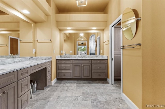 5061 W Oakhill St, Dunnellon, FL 34433 - full bath with two vanities and stone finish flooring