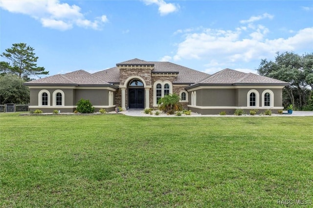 5061 W Oakhill St, Dunnellon, FL 34433 - mediterranean / spanish home featuring stucco siding and a front lawn