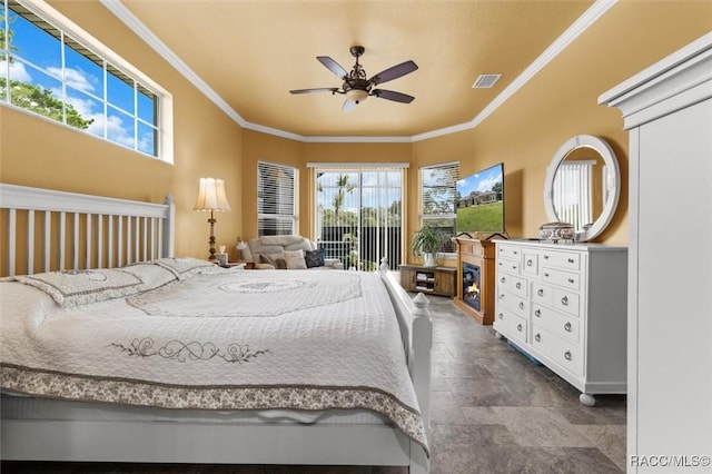 5061 W Oakhill St, Dunnellon, FL 34433 - bedroom featuring crown molding, multiple windows, access to outside, dark stone finish floors, and a ceiling fan