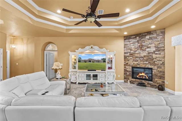 5061 W Oakhill St, Dunnellon, FL 34433 - living area with a raised ceiling, crown molding, a ceiling fan, a fireplace, and recessed lighting