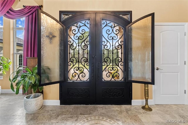 5061 W Oakhill St, Dunnellon, FL 34433 - property entrance featuring french doors and a gate
