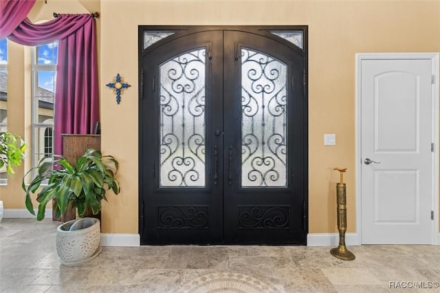 5061 W Oakhill St, Dunnellon, FL 34433 - foyer featuring french doors and plenty of natural light