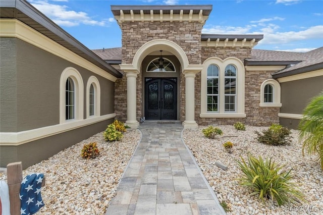 5061 W Oakhill St, Dunnellon, FL 34433 - doorway to property featuring french doors, stone siding, and stucco siding