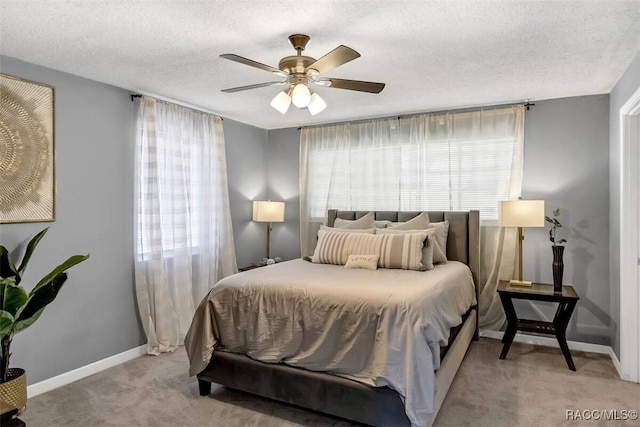 1316 Lake Ariana Blvd, Auburndale, FL 33823 - bedroom with light colored carpet, baseboards, a textured ceiling, and a ceiling fan