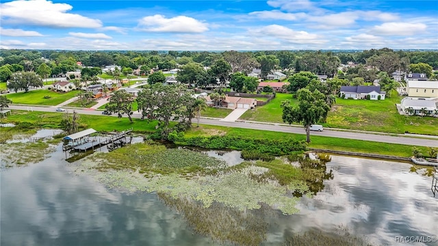 1316 Lake Ariana Blvd, Auburndale, FL 33823 - aerial perspective of suburban area featuring a nearby body of water and a tree filled landscape