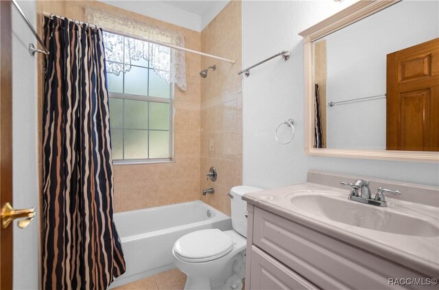 3565 S Oakdale Ter, Inverness, FL 34452 - full bathroom with shower / tub combo with curtain, vanity, tile patterned floors, and toilet