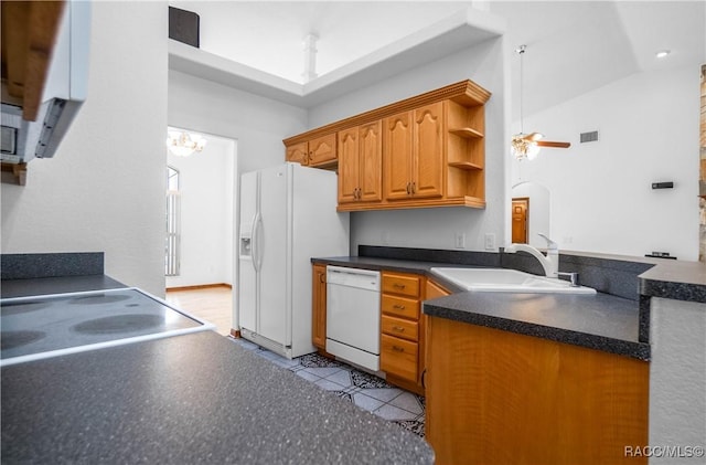 3565 S Oakdale Ter, Inverness, FL 34452 - kitchen with vaulted ceiling, ceiling fan with notable chandelier, sink, light tile patterned floors, and white appliances