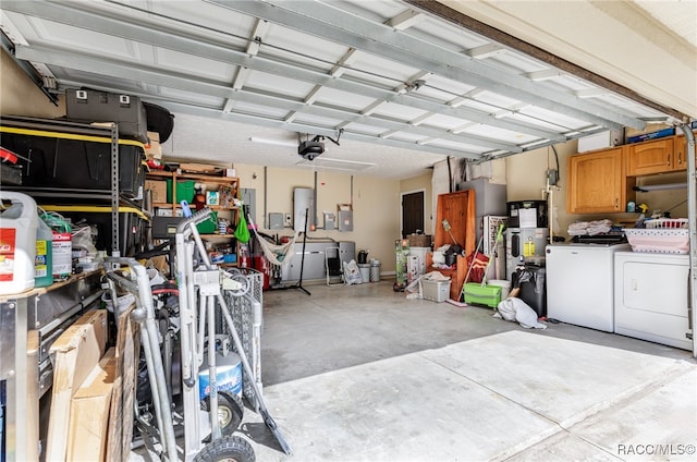 garage with independent washer and dryer and a garage door opener