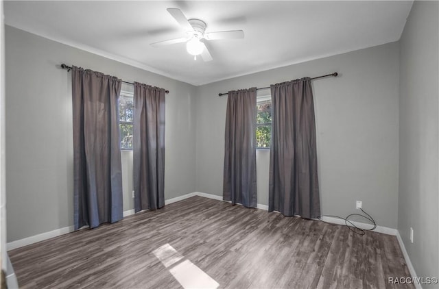 empty room featuring hardwood / wood-style flooring and ceiling fan