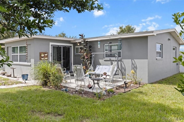 2 William Tell Ln, Beverly Hills, FL 34465 - back of house with stucco siding, a patio, and a yard
