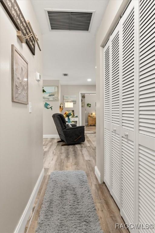 2 William Tell Ln, Beverly Hills, FL 34465 - corridor with light wood-type flooring and baseboards