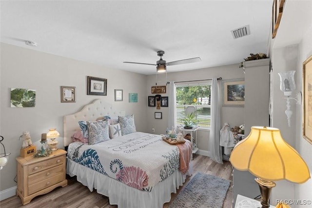 2 William Tell Ln, Beverly Hills, FL 34465 - bedroom featuring wood finished floors and a ceiling fan