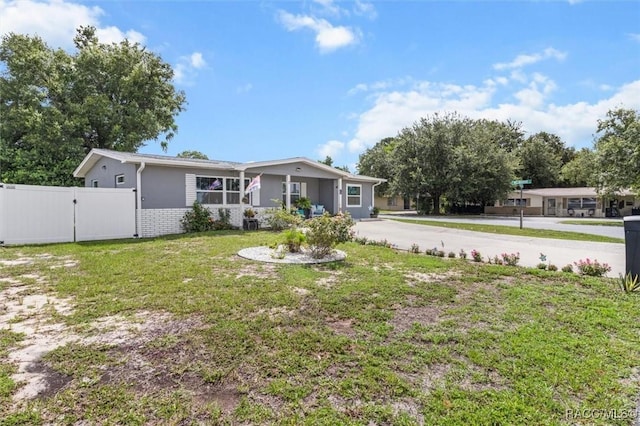 2 William Tell Ln, Beverly Hills, FL 34465 - view of front facade featuring driveway and a gate