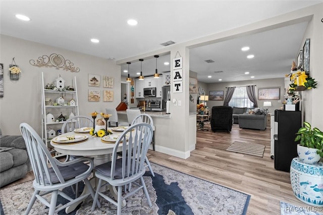 2 William Tell Ln, Beverly Hills, FL 34465 - dining room with light wood-style flooring and recessed lighting