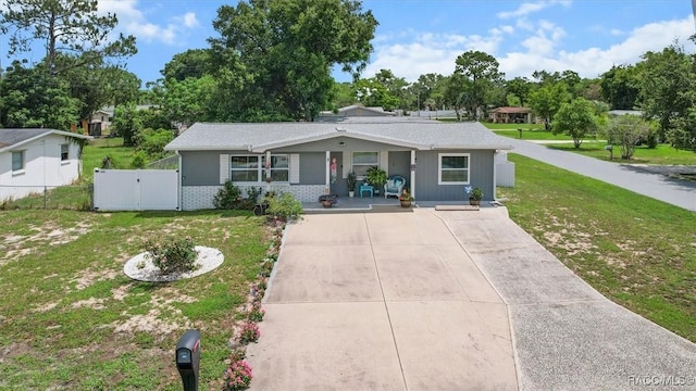 2 William Tell Ln, Beverly Hills, FL 34465 - view of front of home with a gate, covered porch, and brick siding