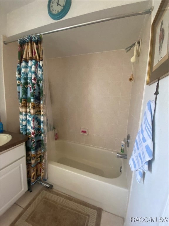 bathroom featuring tile patterned floors, vanity, and shower / bath combination with curtain