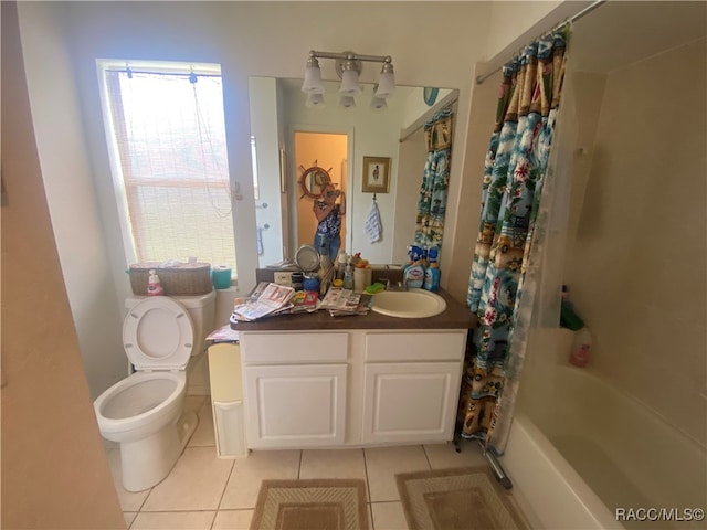 full bathroom with tile patterned floors, vanity, shower / tub combo, and toilet