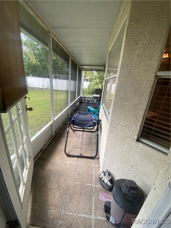 sunroom / solarium with a healthy amount of sunlight