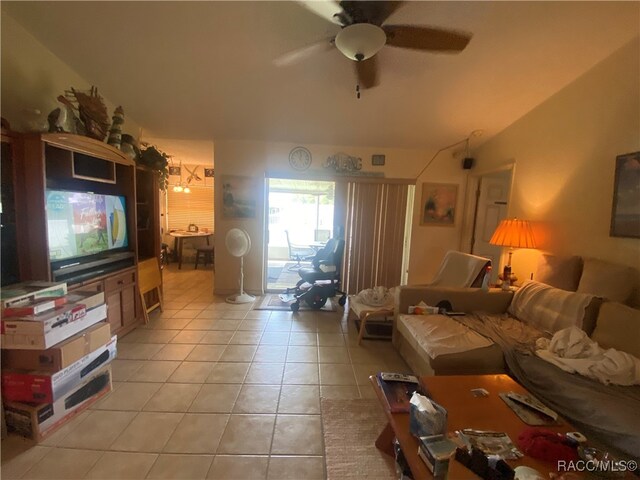 living room with light tile patterned floors and ceiling fan