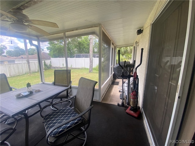 sunroom / solarium with ceiling fan