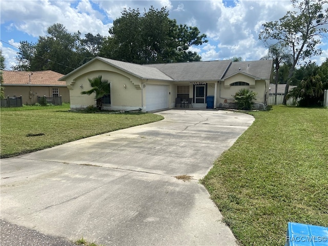 single story home with a front yard and a garage