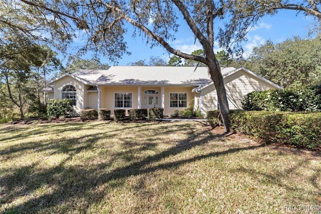 single story home with a front lawn