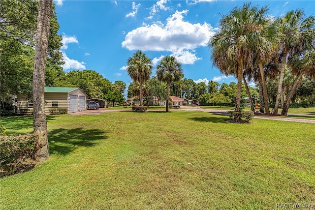 view of yard with an outbuilding and a garage